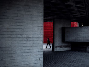 Man walking through an urban walkway