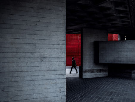 Man walking through an urban walkway