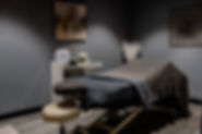Massage bed in treatment room.
