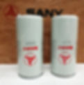 Two light gray SANY fuel filters with red logos stand on a white surface. The background is a wooden texture with a large SANY logo.