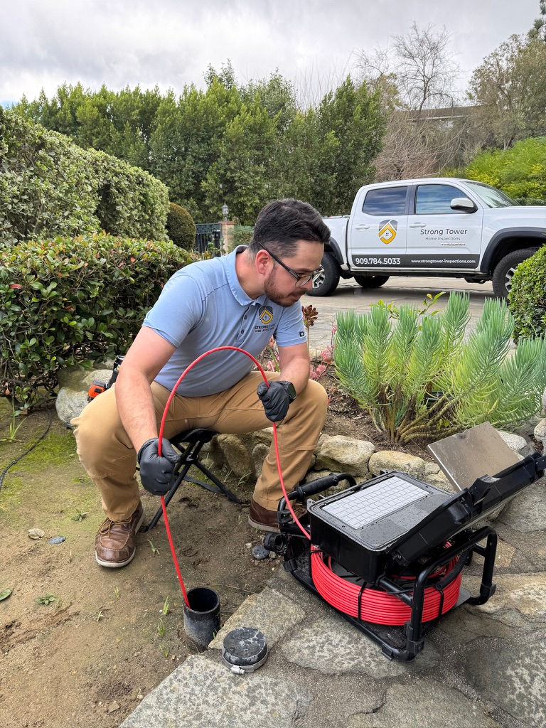 Certified home inspector performing a Sewer Line Inspection with Camera in Riverside CA