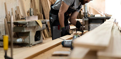carpenter-cutting-mdf-board-inside-workshop (1)_edited.jpg