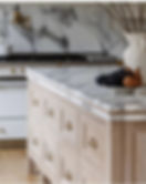 Kitchen island with marble top and wood drawers
