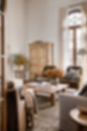 Quiet luxury living room with transitional carpet and vintage cabinet