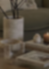 Quiet luxury table styling with stone vases and coffee table books