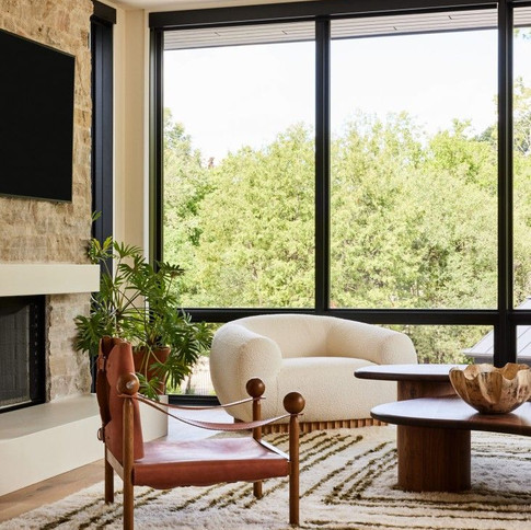 Living room with quiet luxury design using curved sofa and leather chair 