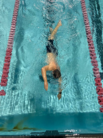 Oakdale Aquatics Masters swimmer coming into the wall.