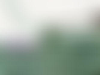 Close-up of green silk-linen crochet stitches, with the third loop placement clearly highlighted in pink.