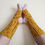 Thumbnail: Prana Yoga Socks crochet pattern soles together yellow variation