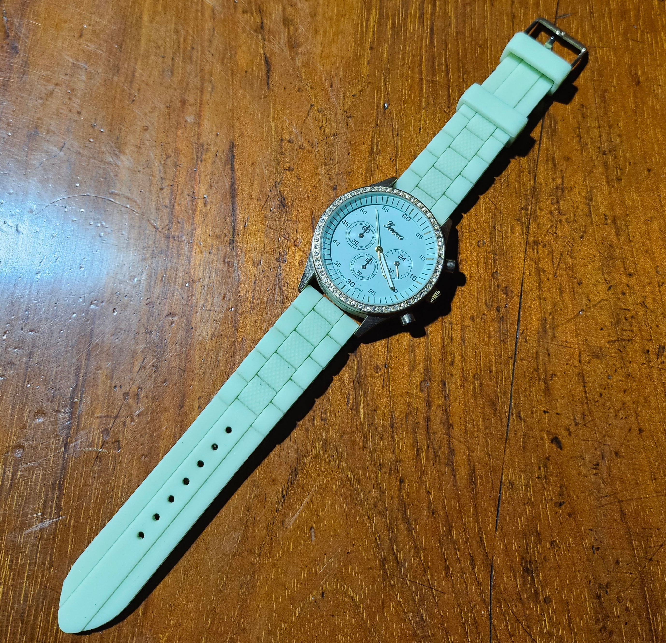 Watch: Vintage Geneva Platinum Rhinestone Adorned Watch W/ Green Silicone Band