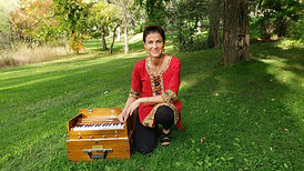 Kathleen Karlsen with a harmonium for leading mantras and chanting
