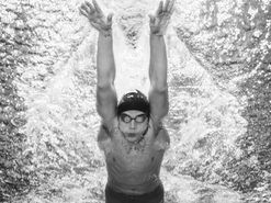 Swimgainz academy swimmer captured at the start of his butterfly catch phase
