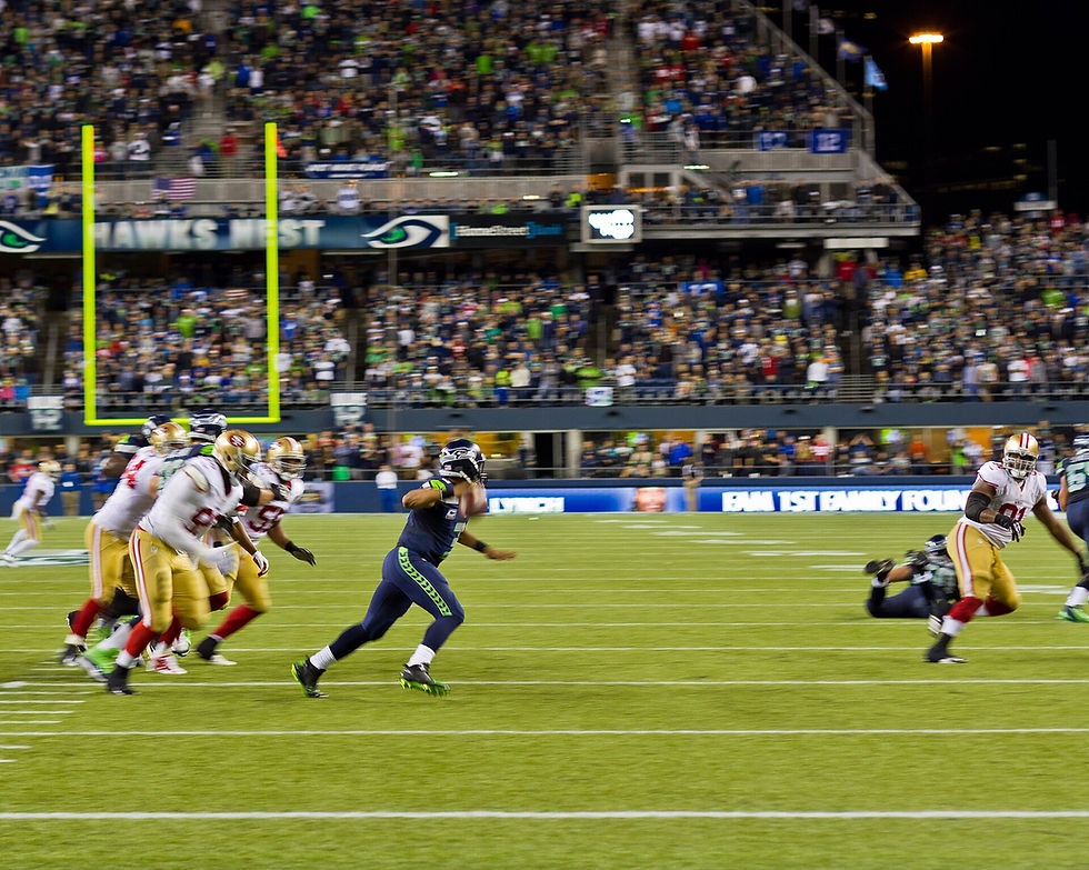 49ers and Seahawks players in action at Lumen Field