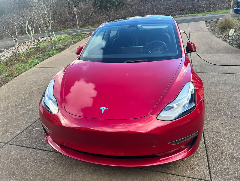Red 2023 Tesla Model 3 from the ORCritters fleet in Salem, Oregon.