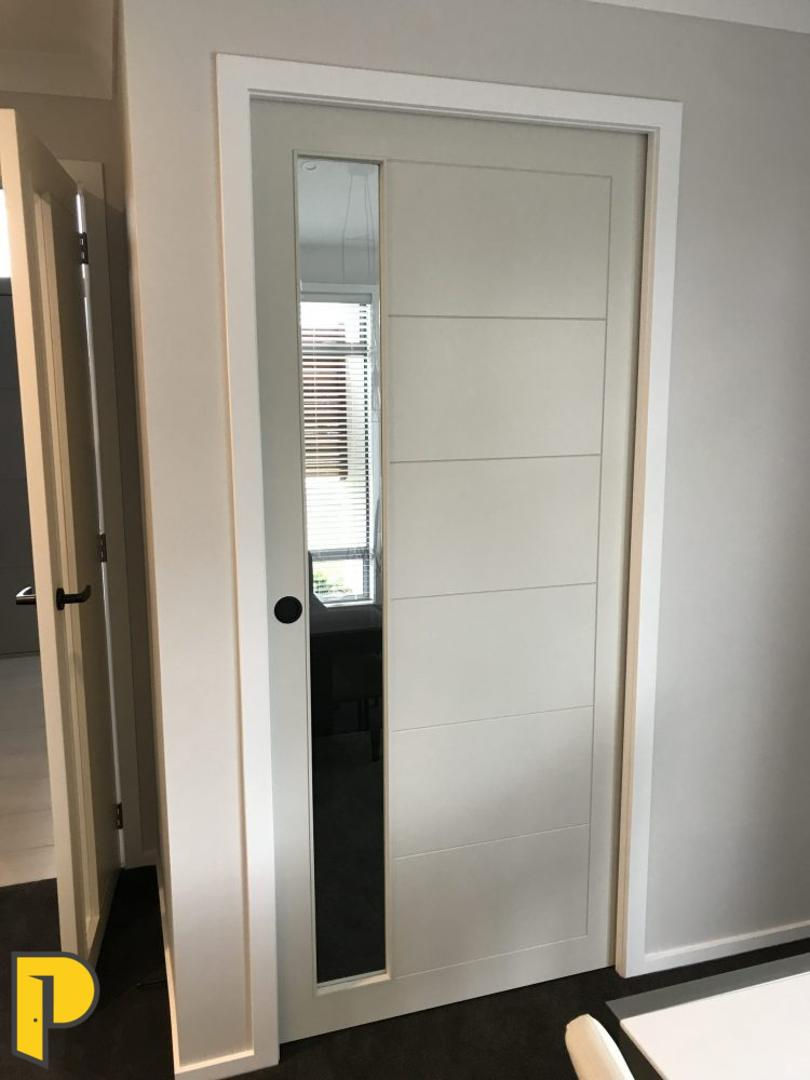 Stafford door cavity slider, with lake side glass panel- Paraparaumu Doors & Joinery - Kapiti, Wellington