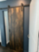 Grooved rustic barn door, with black classic track - Paraparaumu Doors & Joinery