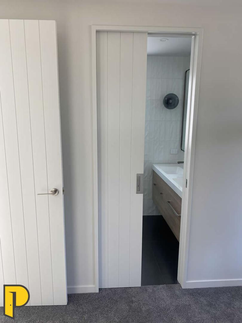 Avon V door, 2200 high cavity slider, CL400 privacy handle, gib grooved jambs - Paraparaumu Doors & Joinery Wellington