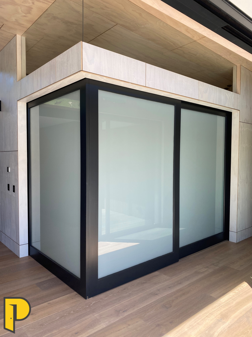 Double stack, corner meeting over the wall slider unit, 1 light opal lam doors, paint quality doors- Paraparaumu Doors & Joinery - Kapiti, Wellington