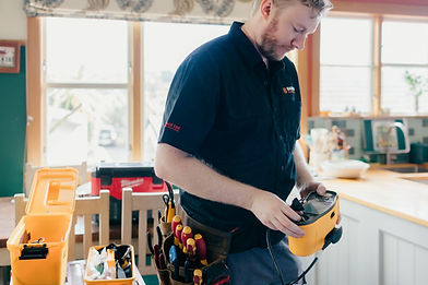 Luke from Barrow Electrical getting ready to use specialised testing equipment to help fin