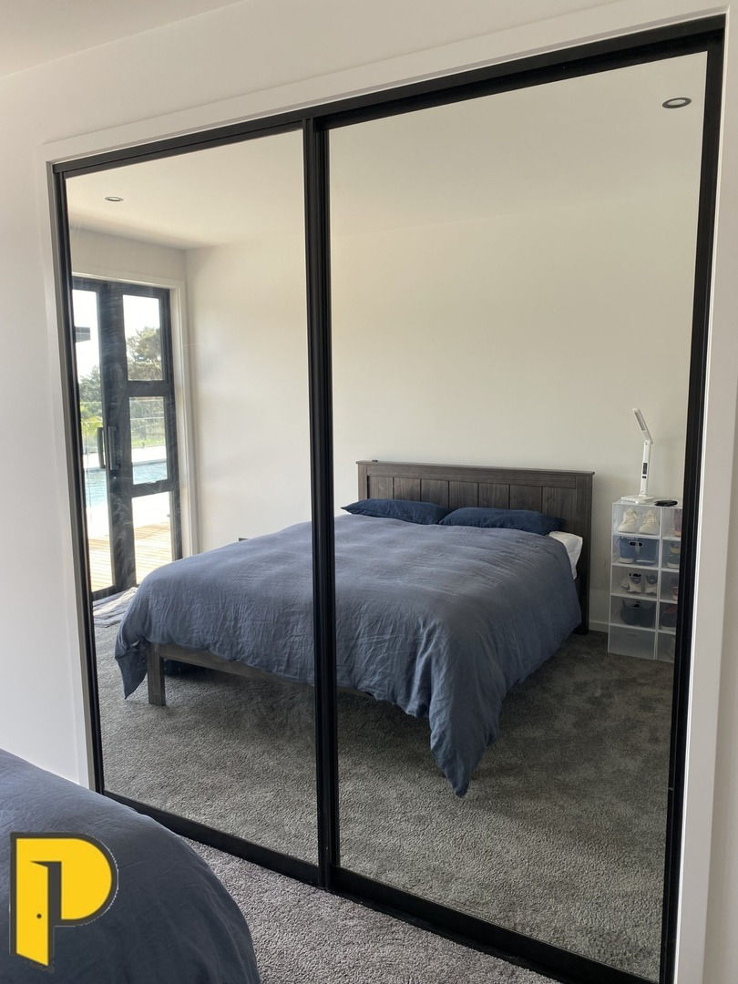 Whisper slider pair, black tracks and frames mirrors on both doors - Paraparaumu Doors & Joinery - Kapiti, Wellington