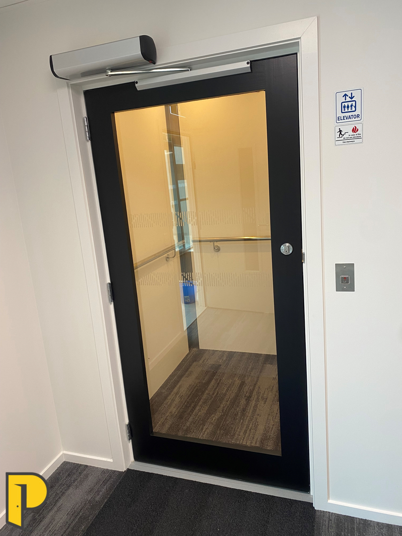 Lift glass door, 1 light door clear glass, lift door with glass flush to inside of lift- Paraparaumu Doors & Joinery - Kapiti, Wellington
