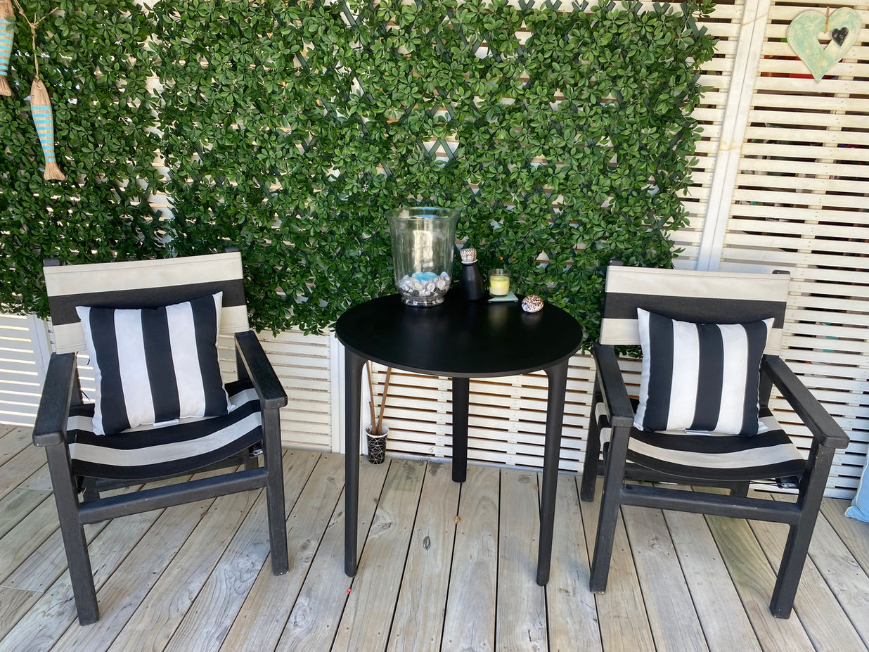 Private outdoor seating in the bbq area at Aroha Tiny House B&B - Peka Peka, Waikanae