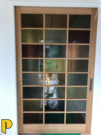 Clear cedar 24 light door with coloured glass, in a cavity slider unit- Paraparaumu Doors & Joinery - Kapiti, Wellington