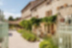 A charming stone building that is a luxury hotel and winery