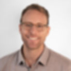 Smiling man wearing glasses
