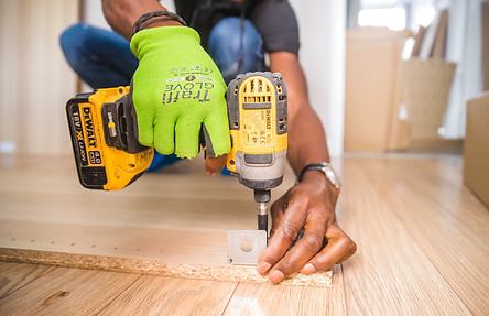 person-using-dewalt-cordless-impact-driv