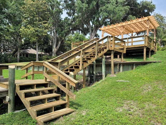 Cedar pergola and some stairs leading down to the water
