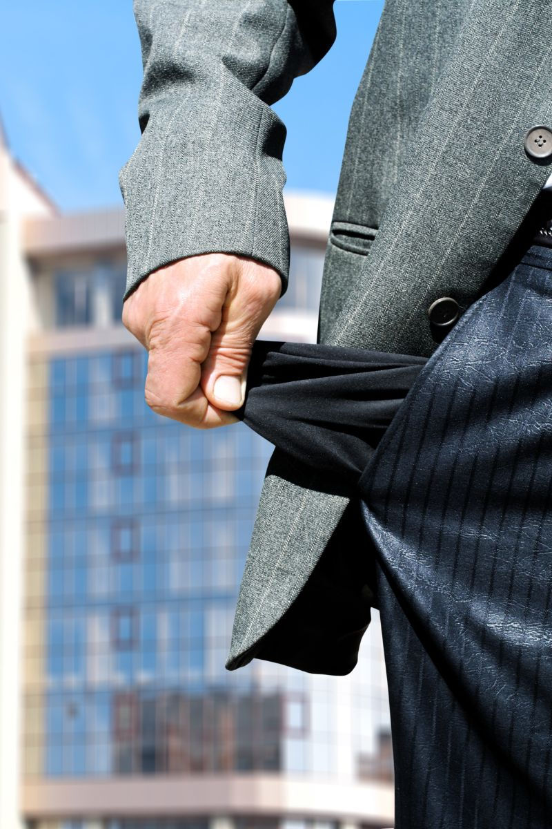 man showing an empty suit pocket