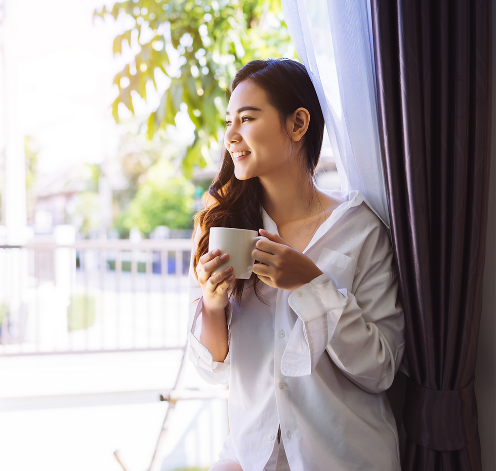 young professional thinking about starting her own business while drinking coffee