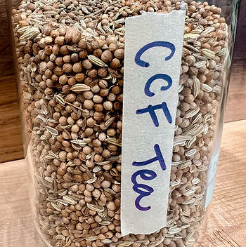 glass jar of CCF tea-which stands for cumin, coriander, and fennel.