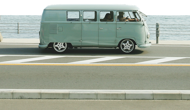 vw-van-driving-across-ocean.png