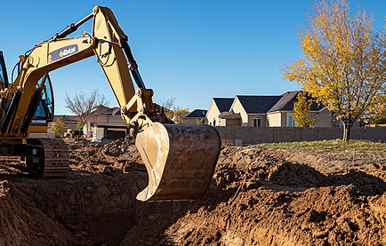 operator excavating soil in a suburban construction site.jpg