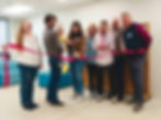 Members of the Bartley and Borkowski families cutting the ribbon.