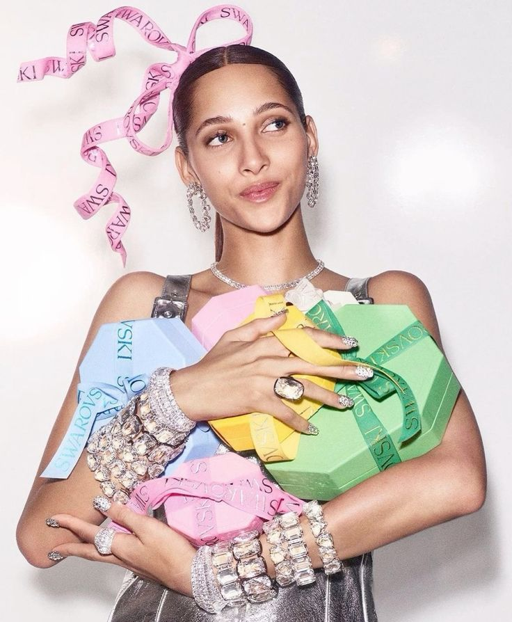 swarovski ad campaign with a model and lots of products
