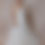 Thumbnail: Model wearing plus size couture vintage wedding dress against beige backdrop