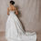 Thumbnail: Full back view of model wearing a vintage 1999 Vera Wang wedding dress with a ball gown skirt and long train