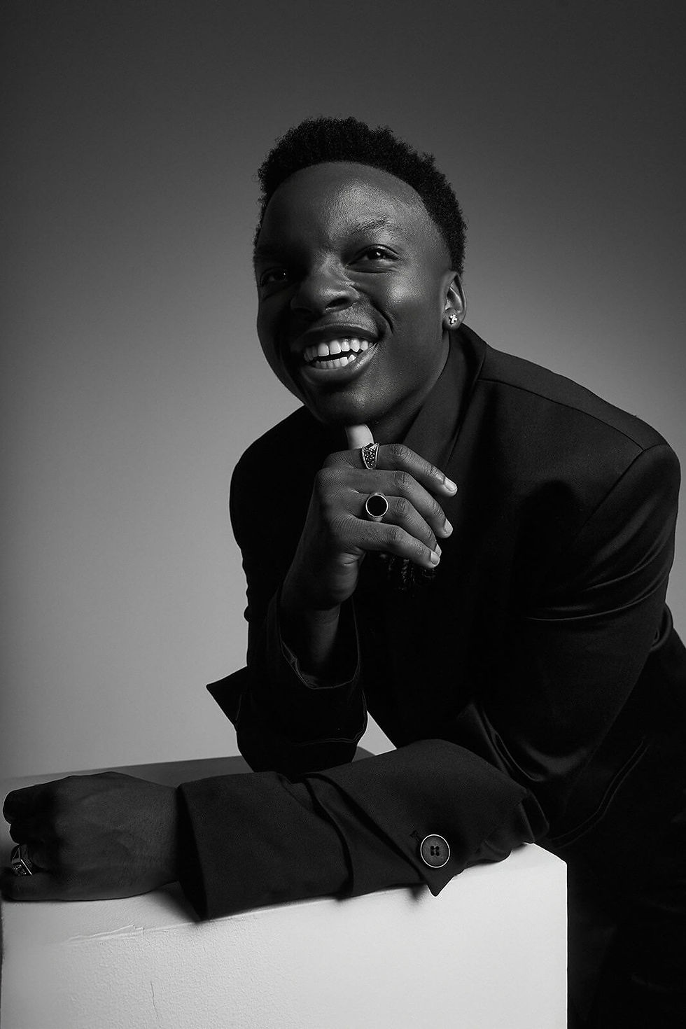 Big Will Simmons smiling in a soft black and white pose