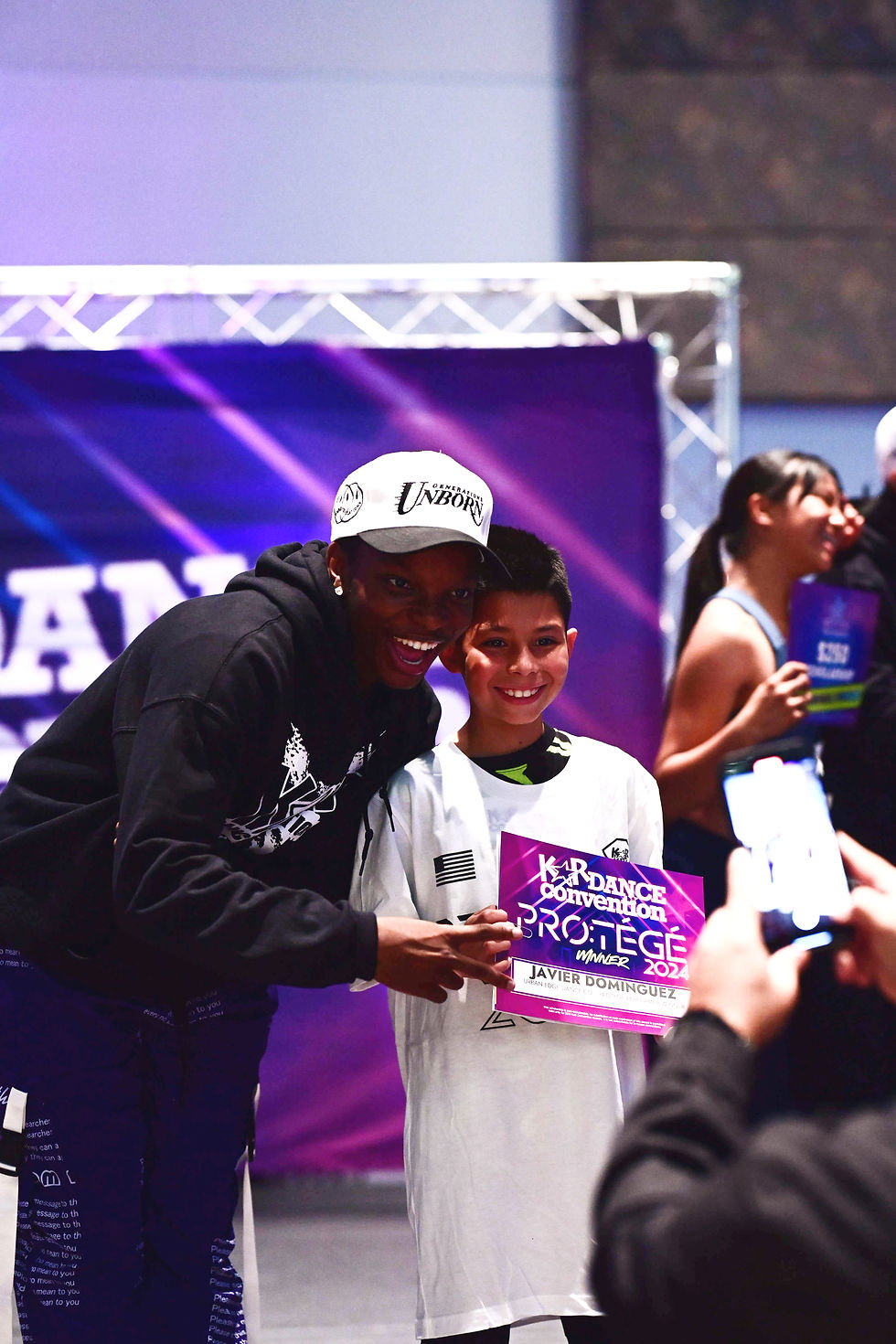Big Will Simmons pictured with a dance student receiving an award
