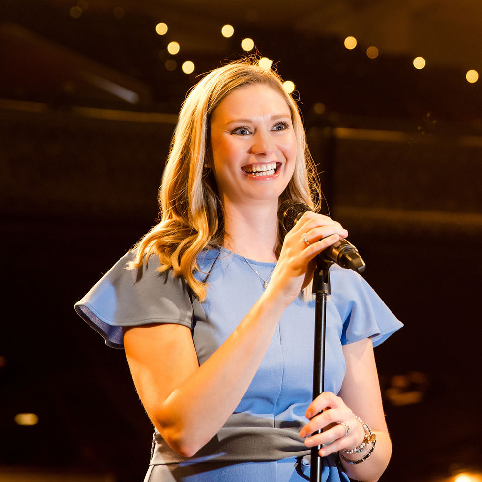 Ashley Lentz delivering a keynote speech on leadership and faith to a Midwest audience