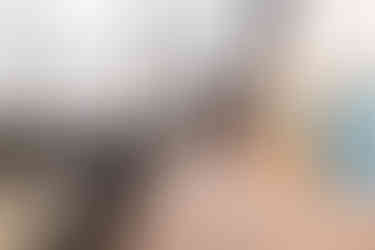 Large composite upper deck with scenic view and black aluminum railing built by Lake Lumber.