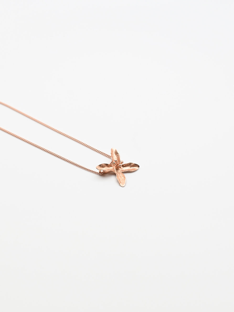 Thumbnail: Lily Flower Design Rose Gold Pendant on rose gold chain necklace