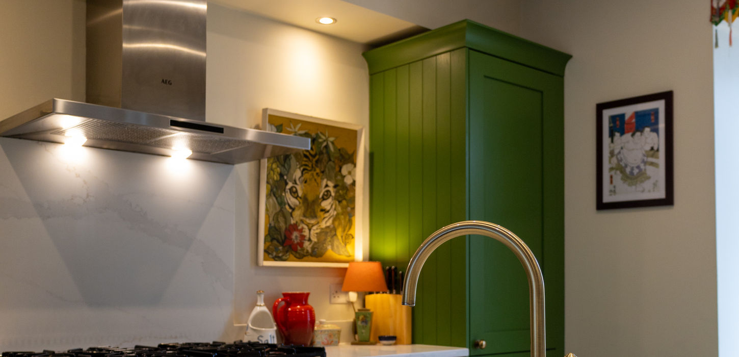 Green shaker kitchen in Wirral with Ashbury cabinets and Calacatta Gold quartz worktops