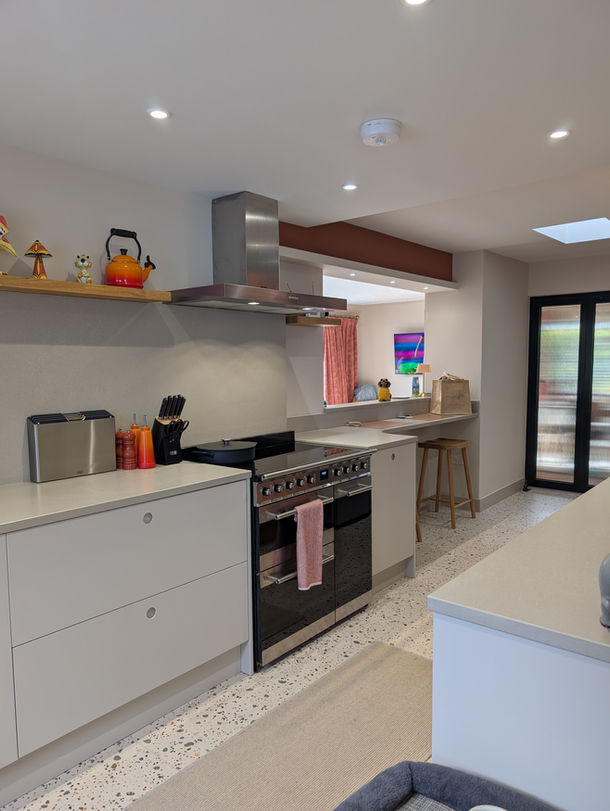Bespoke Porter kitchen in Wirral with matt painted cabinetry and Tuscan Concrete quartz worktops