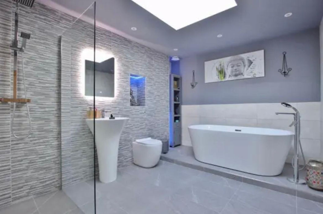 Modern Bathroom with free standing bath, tiled floor & walls