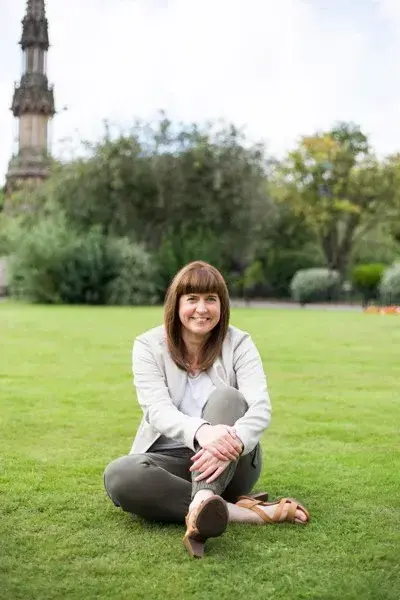 Woman Sitting on Grass James James Kitchens