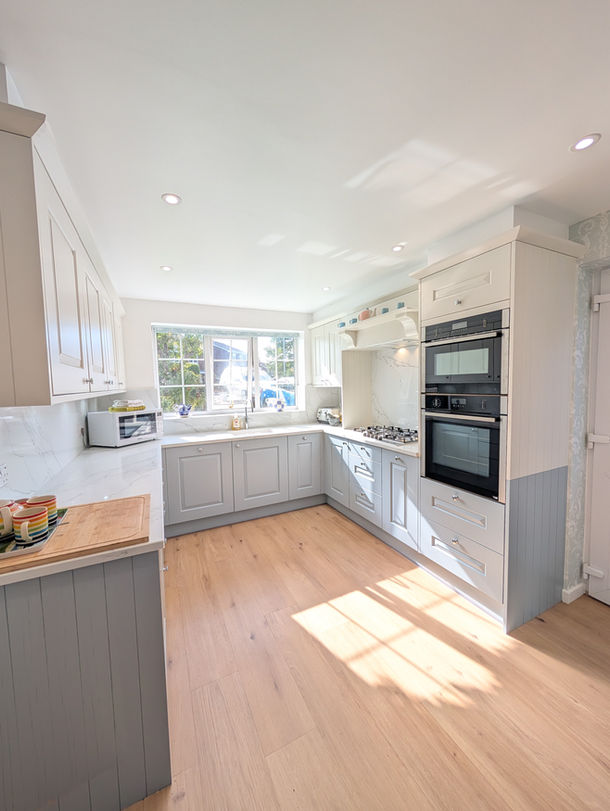 In house kitchen in Irby Wirral with Stamford Oak cabinets in French Grey and Porcelain and Lucca quartz worktops